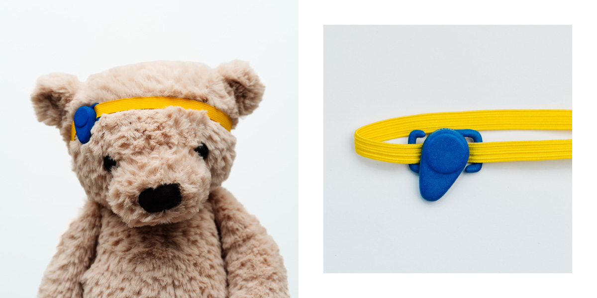 Images shows a plush bear and a toy bone anchored hearing aid